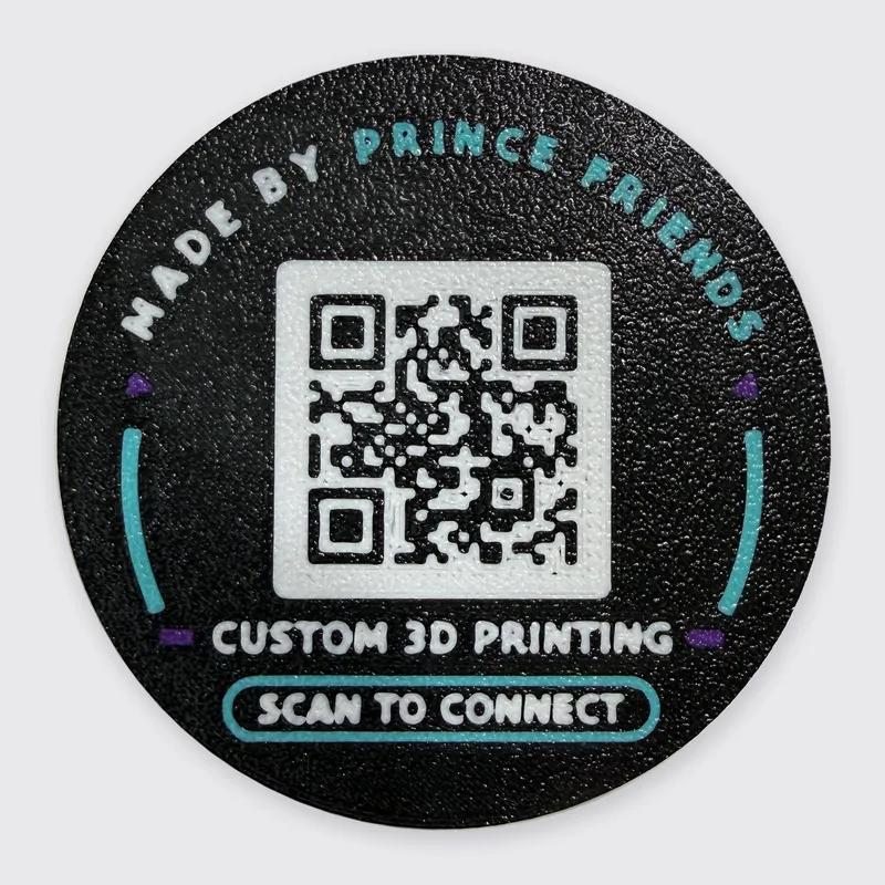 The back of our coin: a white QR code on black, with Made by Prince Friends above it and Custom 3D printing, Scan to connect below it