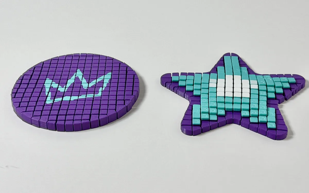 Two flex-tile prints: a purple coin with our teal crown, and a purple, teal and white starfish